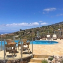 Sitting areas and pool in front of the landscape of Tijarafe