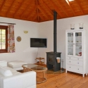 Salon with wood-burning stove in the cottage