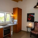 Kitchen with view of the garden and sea